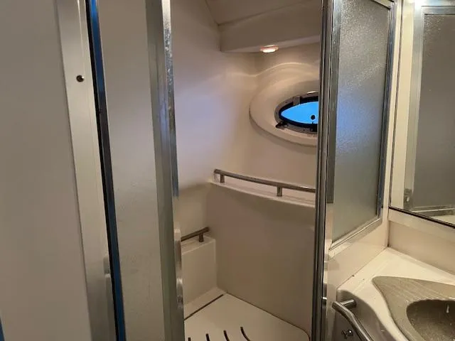Slide: The Image of Bathroom interior of 1998 Maxum 4100 SCR yacht with shower and sink. - 8