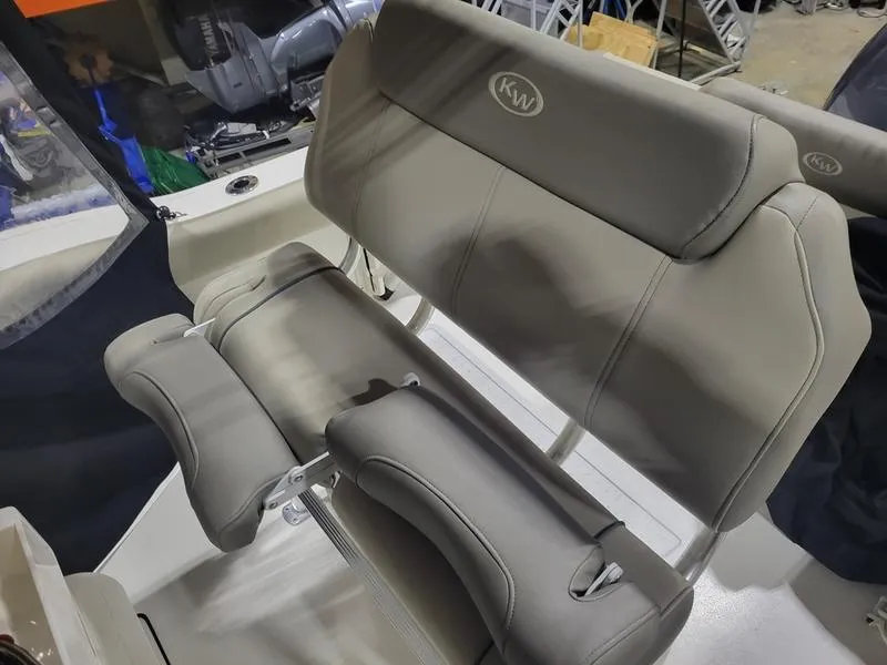 Slide: The Image of 2022 Key West 219fs boat with gray cushioned seating and KW logo. - 15