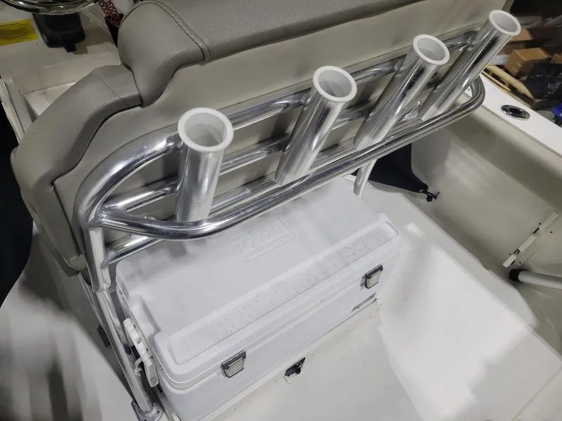 Slide: The Image of 2022 Key West 219fs boat with rod holders and cooler storage. - 17
