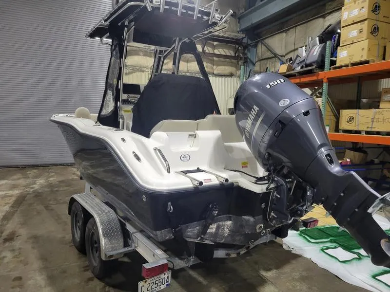 Slide: The Image of 2022 Key West 219fs boat with Yamaha engine on trailer in warehouse. - 8