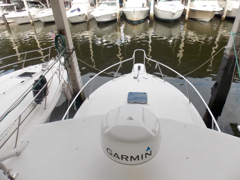 Slide: The Image of 1999 Albemarle 320 Express boat with Garmin equipment docked at marina. - 10