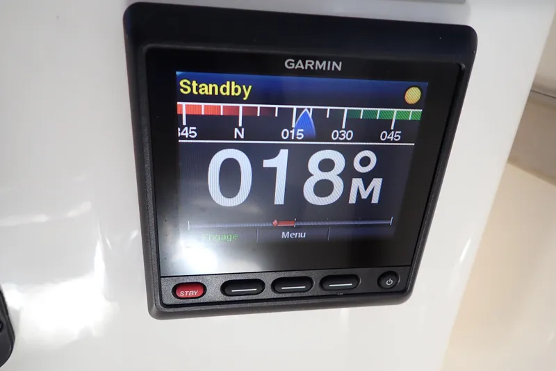 Slide: The Image of Garmin navigation display on 1999 Albemarle 320 Express boat, showing heading and standby mode. - 20