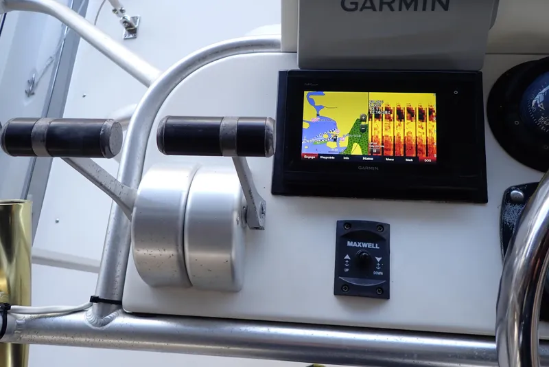 Slide: The Image of Garmin navigation system on 1999 Albemarle 320 Express boat dashboard. - 23