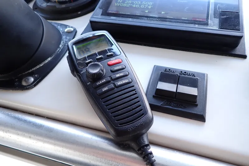 Slide: The Image of Control panel of 1999 Albemarle 320 Express with radio and navigation equipment. - 25