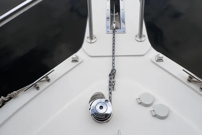 Slide: The Image of Bow of 1999 Albemarle 320 Express with anchor chain and winch. - 28