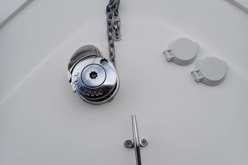 Slide: The Image of Anchor chain and winch on 1999 Albemarle 320 Express boat deck. - 29