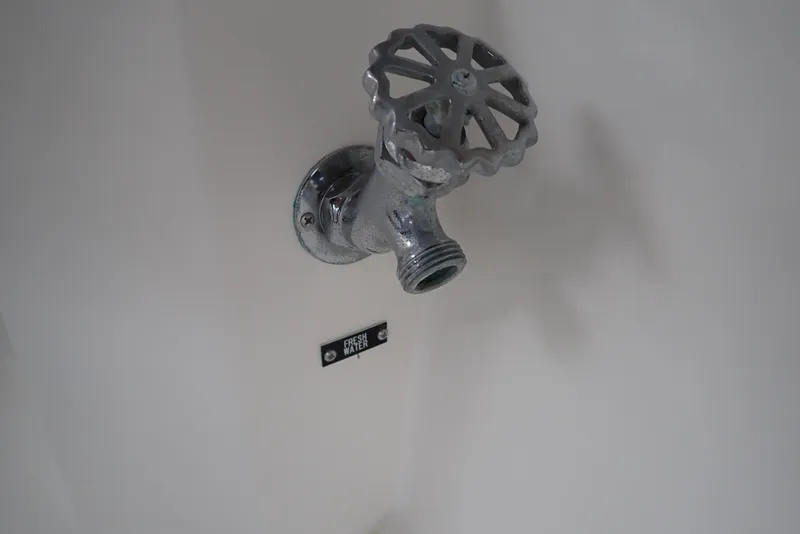 Slide: The Image of Metal valve on Albemarle 320 Express 1999 boat, mounted on a white surface. - 38