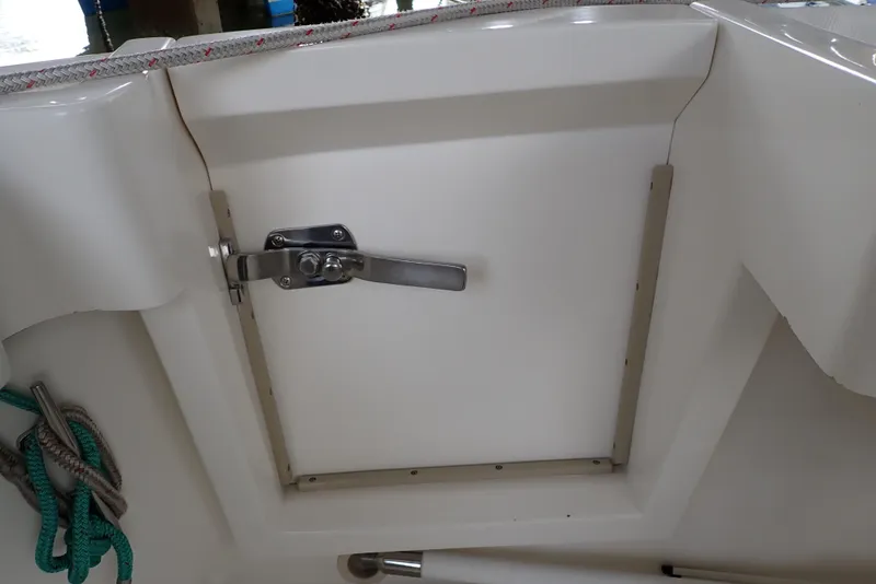 Slide: The Image of 1999 Albemarle 320 Express boat hatch with latch and rope detail. - 39
