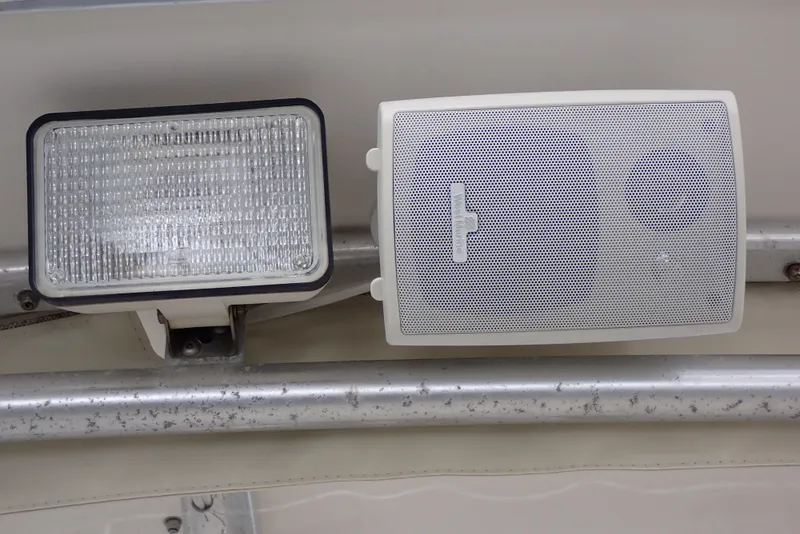 Slide: The Image of Floodlight and speaker on a 1999 Albemarle 320 Express boat. - 42