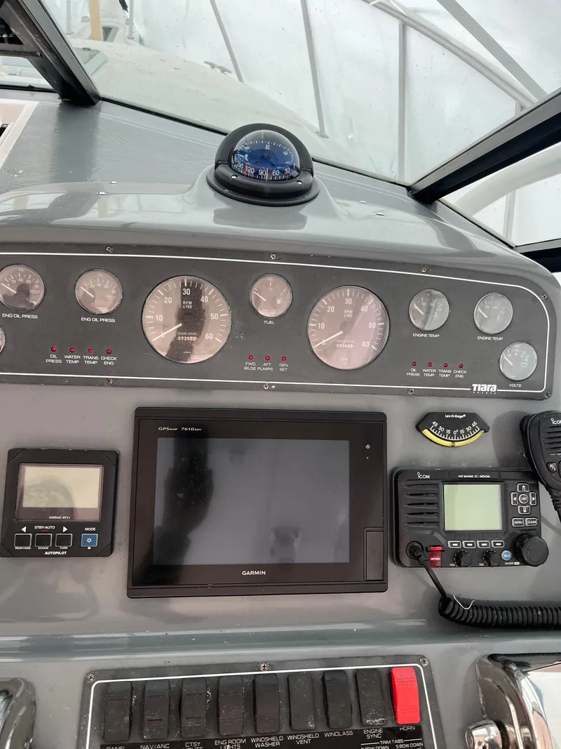 Slide: The Image of Dashboard of a 2004 Tiara Yachts Classic with navigation instruments and controls. - 6