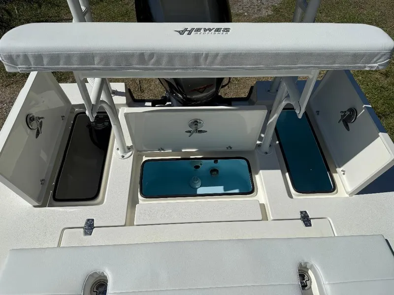 Slide: The Image of 2025 Hewes 16 Redfisher boat interior with storage compartments and seating. - 14