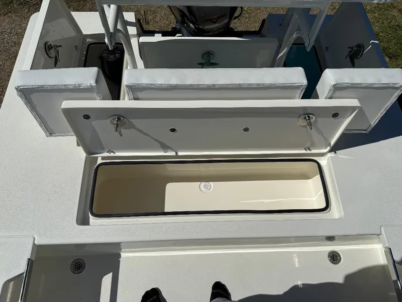 Slide: The Image of 2025 Hewes 16 Redfisher boat interior with open storage compartment. - 25