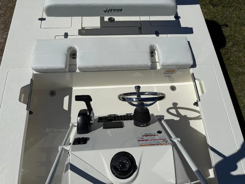 Slide: The Image of 2025 Hewes 16 Redfisher boat interior with steering wheel and seating, top view. - 5