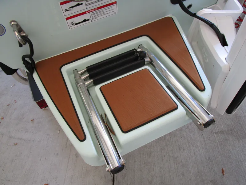 Slide: The Image of Pathfinder TRS 2200 boat ladder, 2025 model, with teak-style steps and safety warnings. - 3