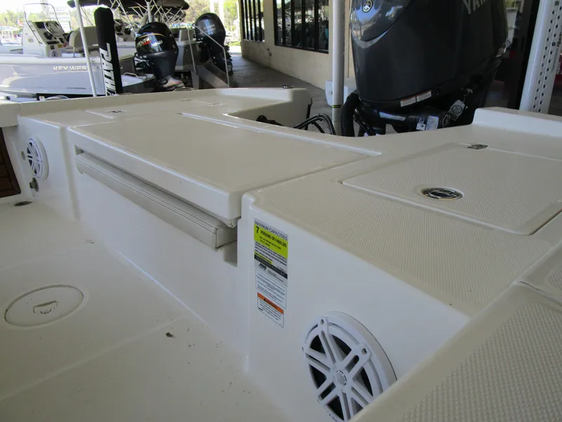 Slide: The Image of 2025 Pathfinder TRS 2200 boat interior with storage compartments and Yamaha engine. - 6