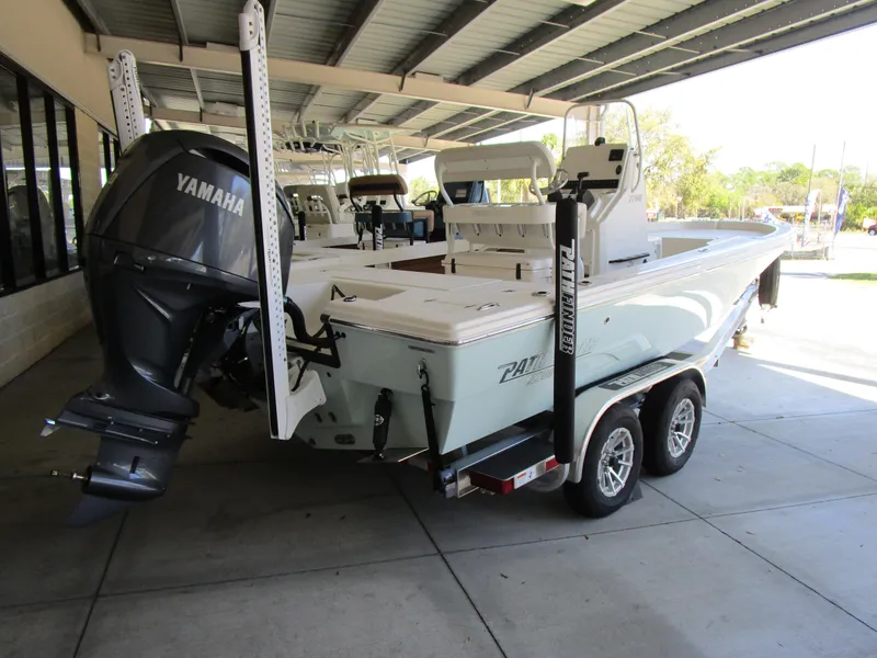 Slide: The Image of 2025 Pathfinder TRS 2200 boat with Yamaha engine on a trailer in a covered area. - 8