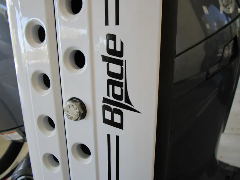 Slide: The Image of Close-up of Pathfinder TRS 2200 Blade logo on white perforated surface, 2025 model. - 9