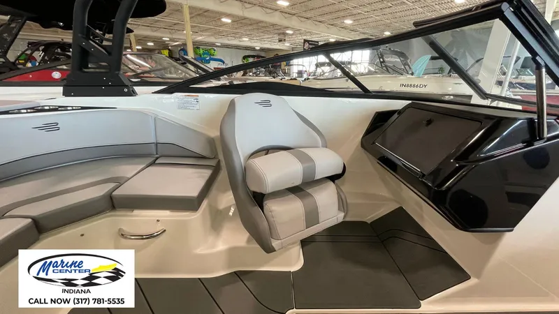 Slide: The Image of Interior of 2025 Bayliner V20i boat with seating and dashboard, displayed at Marine Center Indiana. - 12