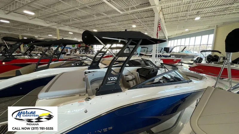 Slide: The Image of 2025 Bayliner V20i boat displayed at Marine Center Indiana showroom. - 14