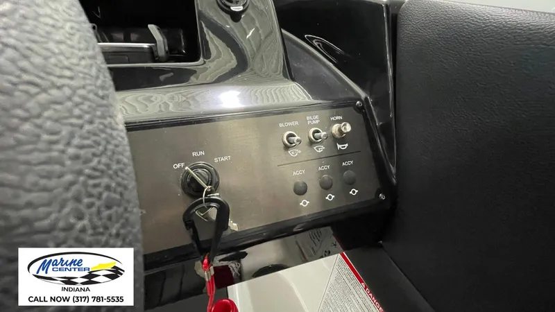 Slide: The Image of Control panel of 2025 Bayliner V20i boat with switches and ignition key. - 3