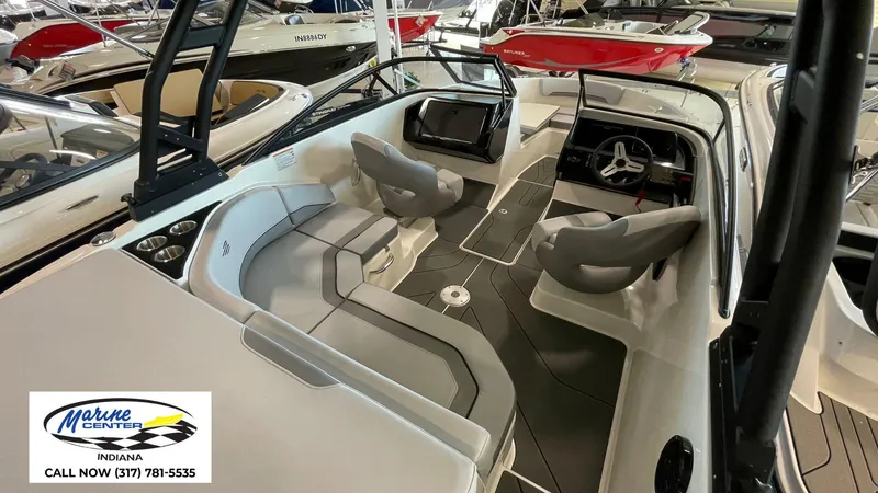 Slide: The Image of 2025 Bayliner V20i boat interior with modern seating and dashboard at Marine Center Indiana. - 4