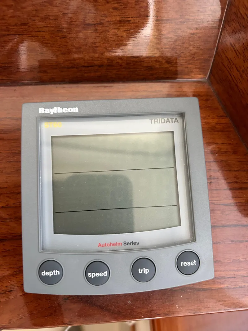 Slide: The Image of Raytheon Tridata display on 2001 Hinckley Classic 36 Picnic Boat dashboard. - 23