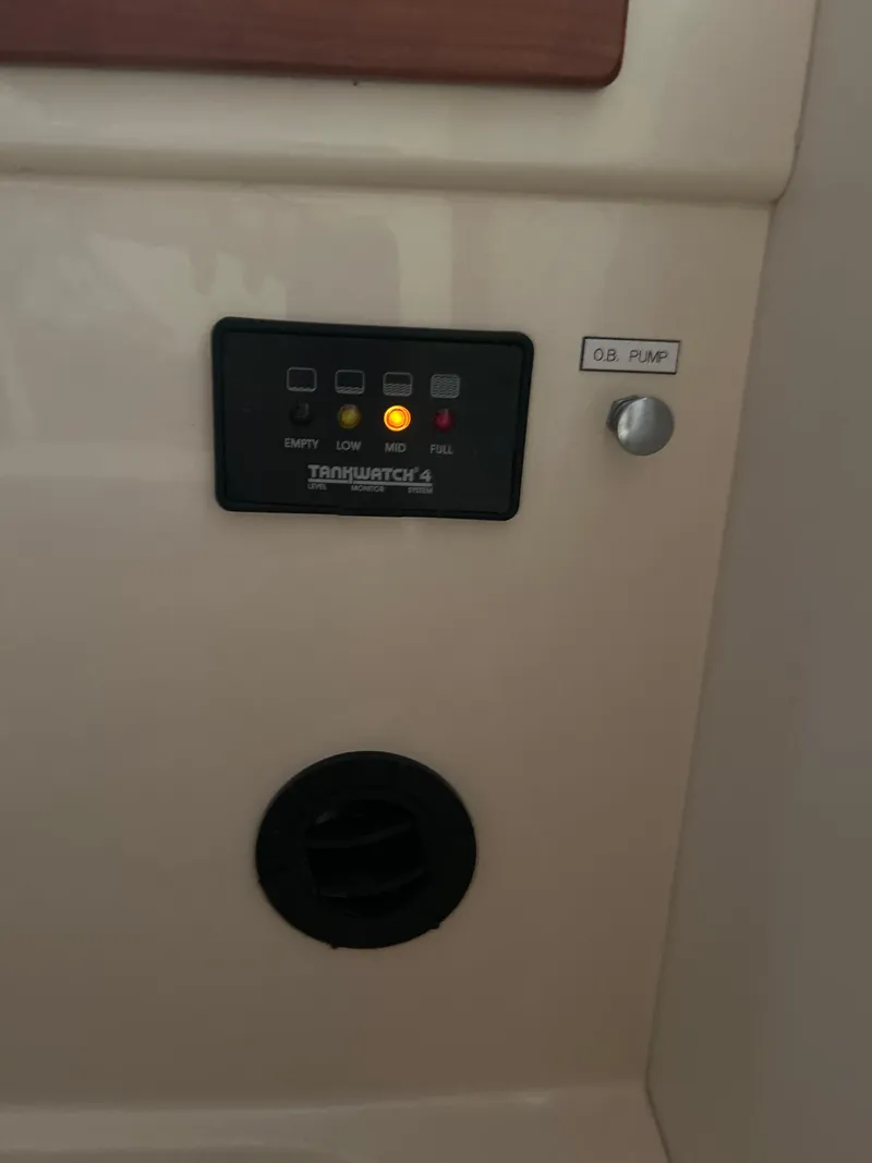 Slide: The Image of Control panel on a 2001 Hinckley Classic 36 Picnic Boat interior. - 44