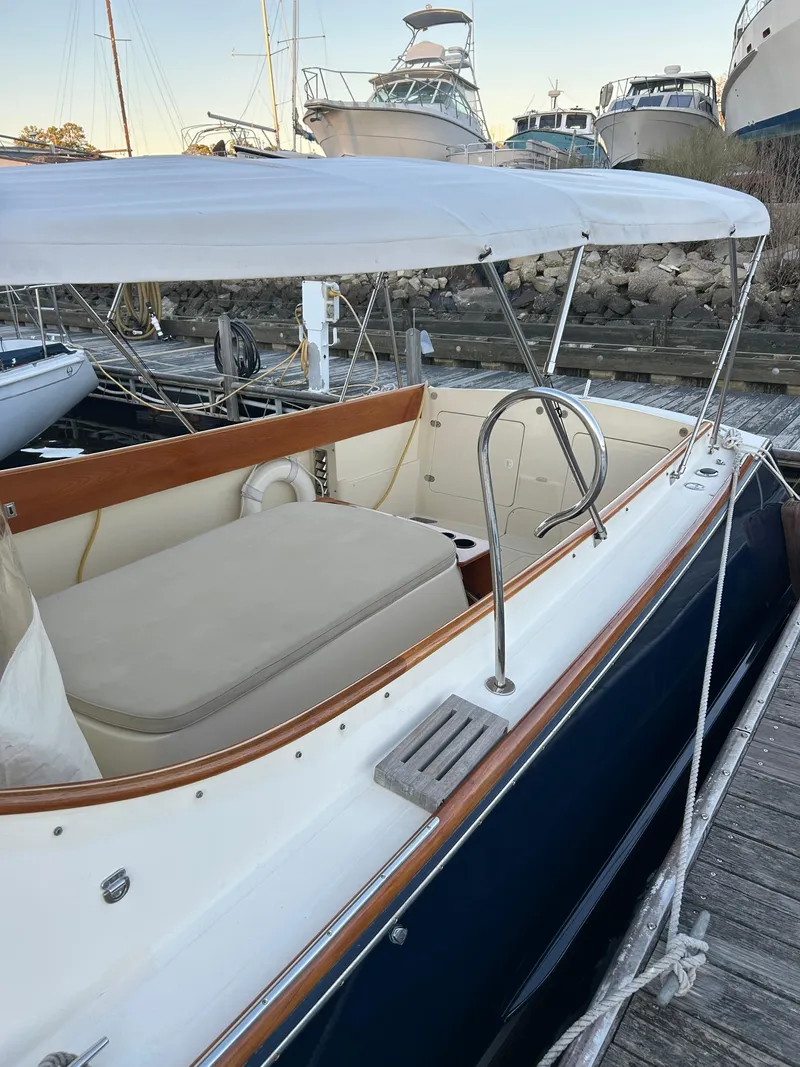 Slide: The Image of 2001 Hinckley Classic 36 Picnic Boat docked, featuring elegant design and spacious seating. - 9