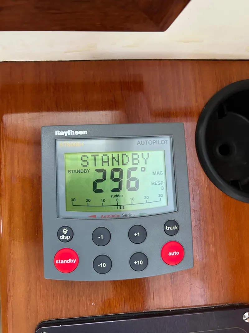 Slide: The Image of Raytheon autopilot display on 2001 Hinckley Classic 36 Picnic Boat, showing standby mode. - 24