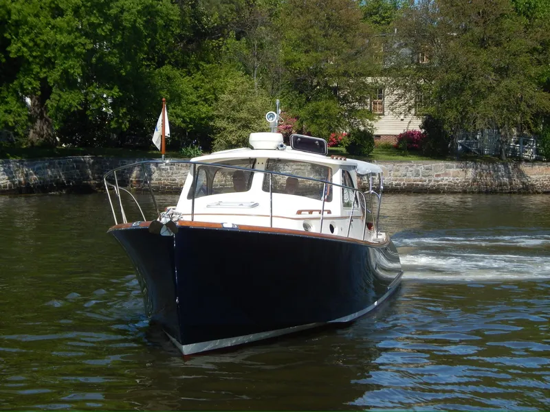 Slide: The Image of 2001 Hinckley Classic 36 Picnic Boat cruising on a scenic river. - 3