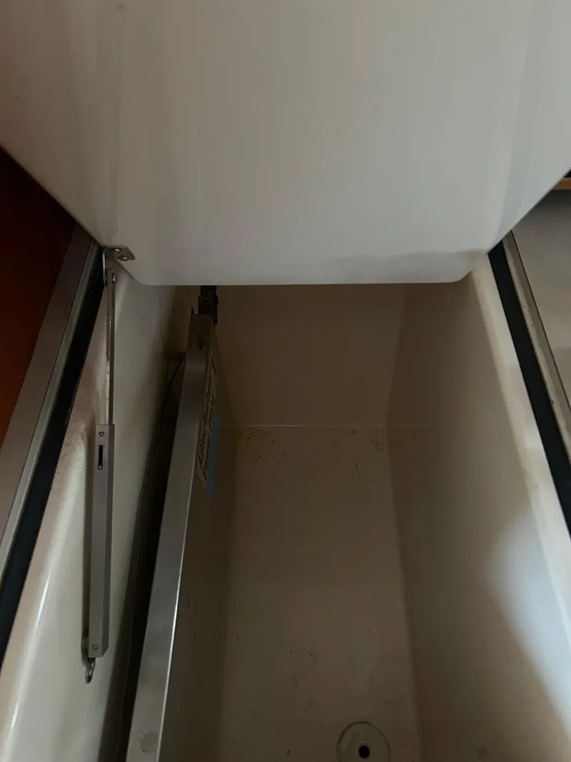 Slide: The Image of Storage compartment inside a 2001 Hinckley Classic 36 Picnic Boat. - 31