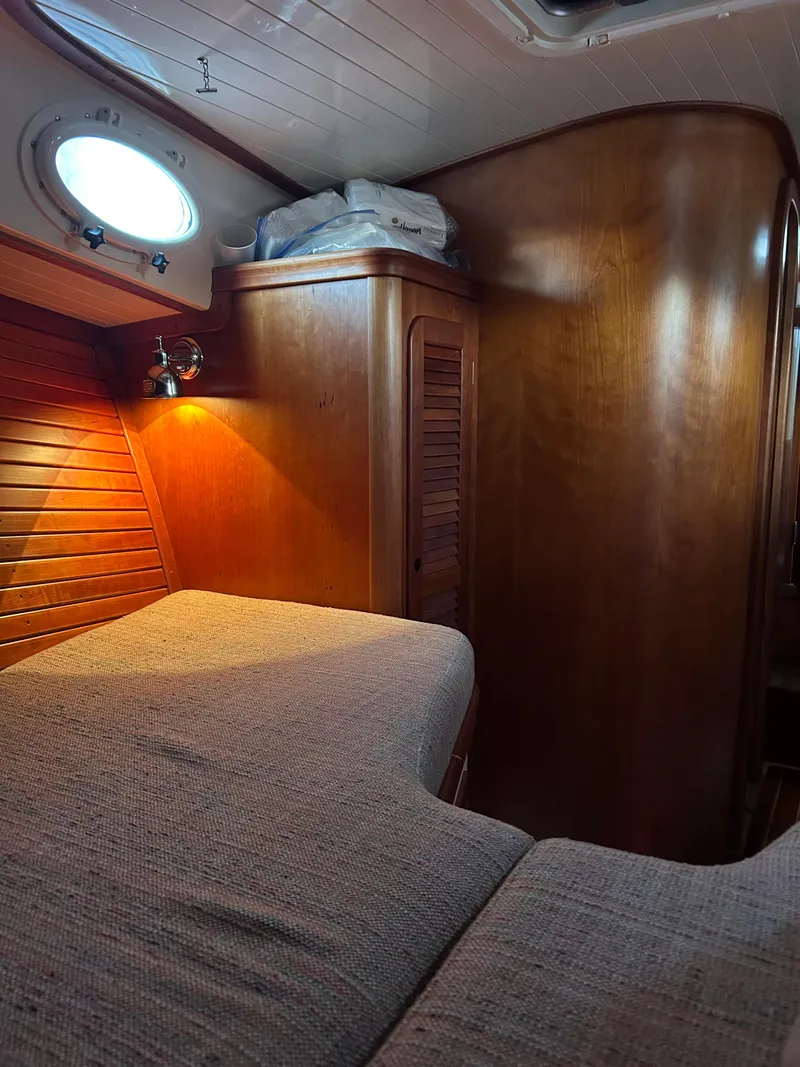 Slide: The Image of Cozy cabin interior of 2001 Hinckley Classic 36 Picnic Boat with wooden finish. - 35