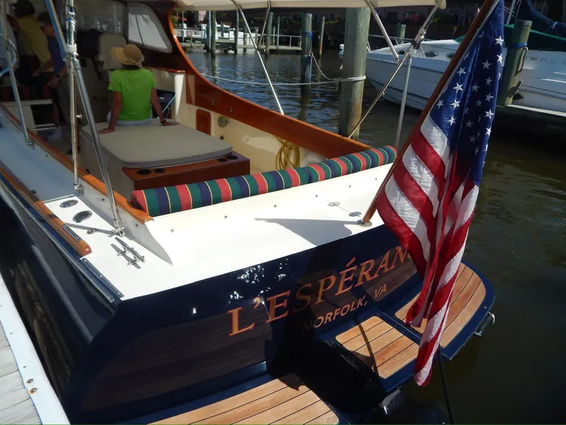 Slide: The Image of Hinckley Classic 36 Picnic Boat, 2001, docked with American flag, Norfolk, VA. - 5