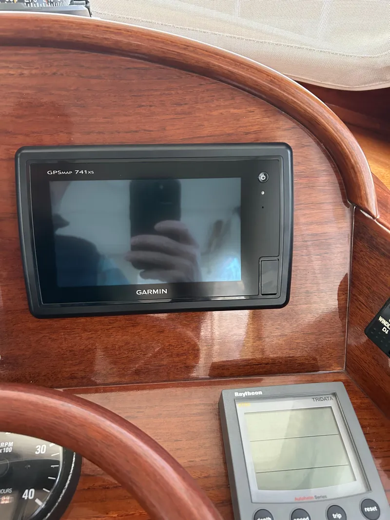 Slide: The Image of Garmin GPS and Raytheon display on 2001 Hinckley Classic 36 Picnic Boat dashboard. - 22