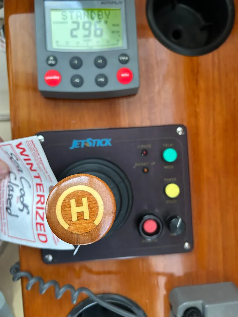 Slide: The Image of Hinckley Classic 36 Picnic Boat 2001 dashboard with JetStick control and winterized tag. - 25