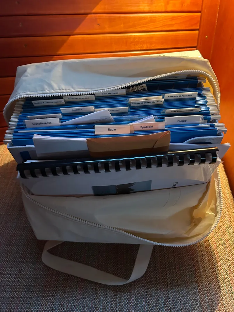 Slide: The Image of Organized documents in a beige bag on a Hinckley Classic 36 Picnic Boat, 2001 model. - 39