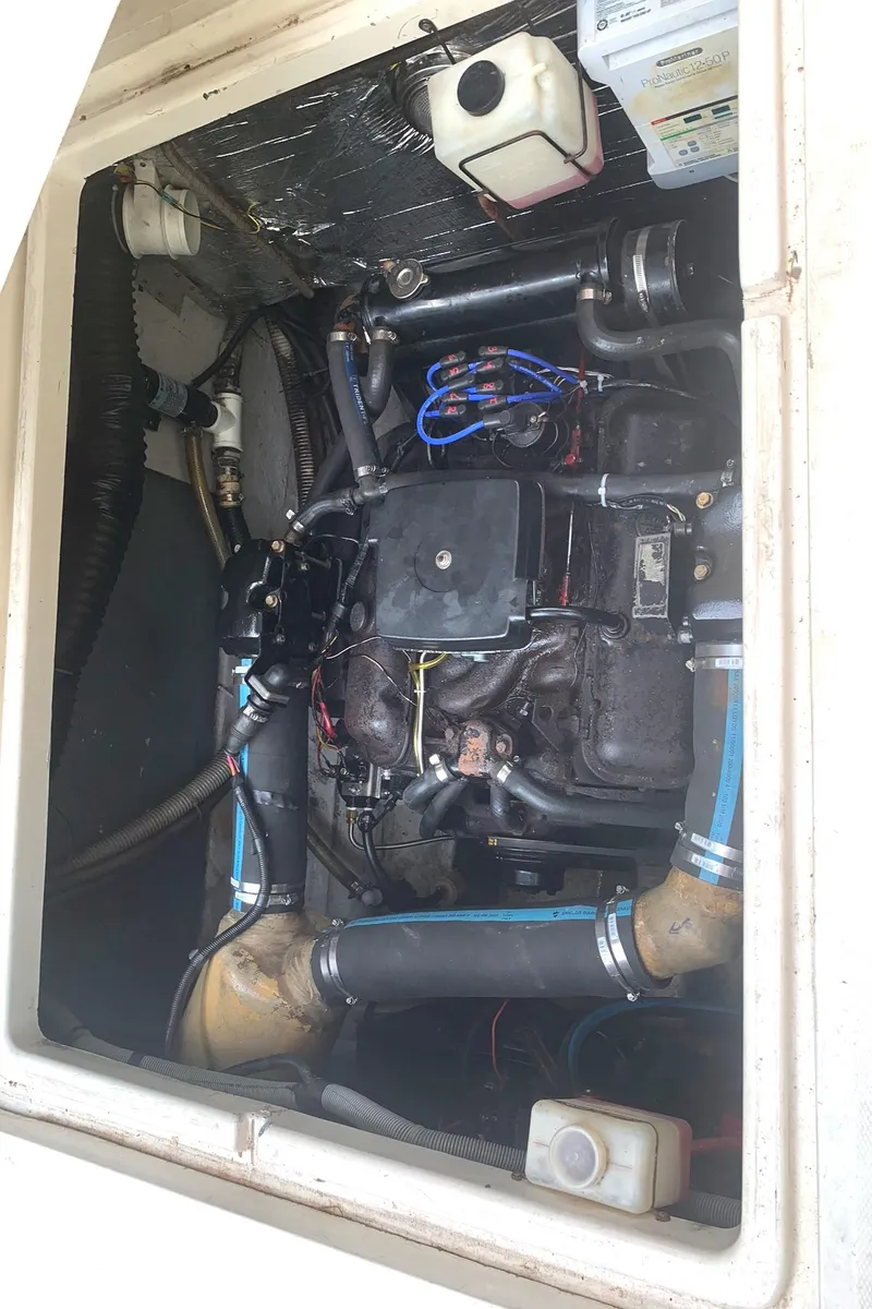 Slide: The Image of Engine compartment of a 1988 Regal 360 XL Commodore, showcasing updated components and wiring. - 22