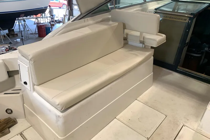 Slide: The Image of 1988 Regal 360 XL Commodore interior seating, nicely updated, showcasing clean white upholstery. - 26