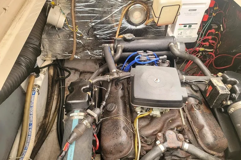 Slide: The Image of Engine compartment of a 1988 Regal Commodore 360 boat, showcasing wiring and components. - 29