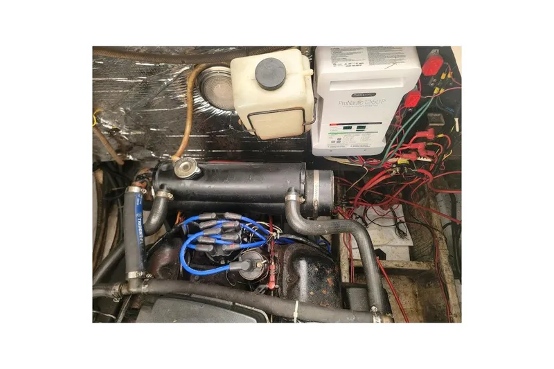 Slide: The Image of Engine compartment of a 1988 Regal Commodore 360 with wiring and components visible. - 30