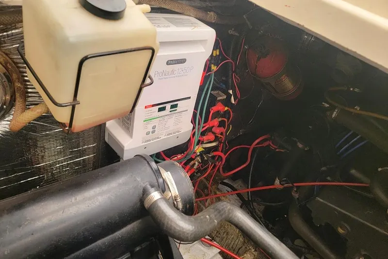 Slide: The Image of Engine compartment of a 1988 Regal Commodore 360 with ProNautic 1250P charger and wiring. - 31