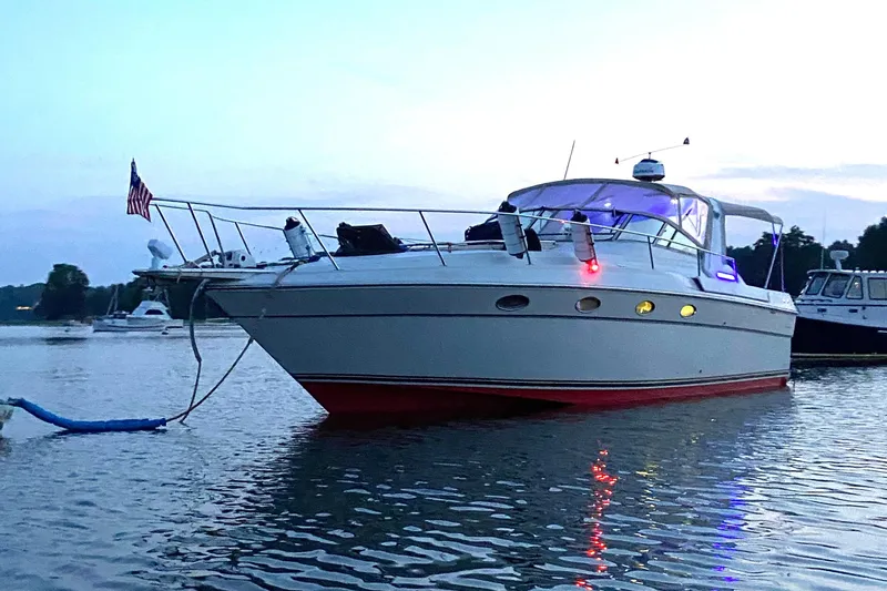 Slide: The Image of 1988 Regal 360 XL Commodore boat on calm water at dusk, nicely updated. - 36