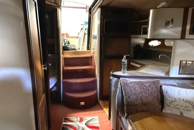 Slide: The Image of 1988 Regal 360 XL Commodore interior with updated features and cozy living space. - 7