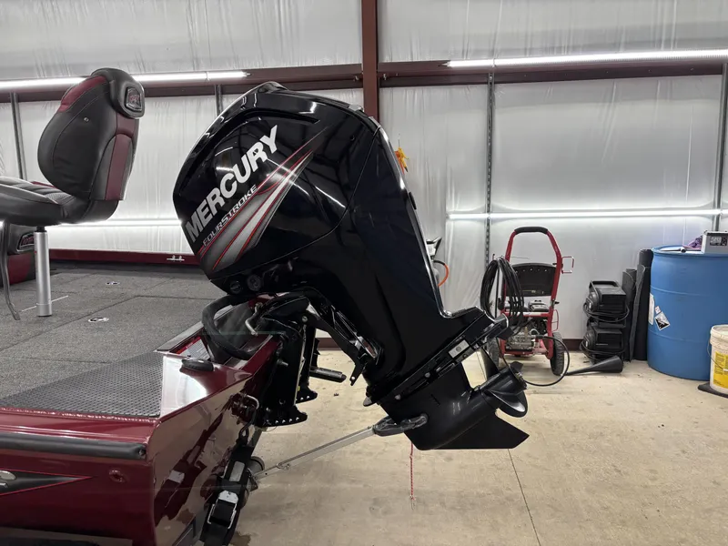 Slide: The Image of 2019 Ranger RT178 boat with Mercury outboard motor in a garage setting. - 10