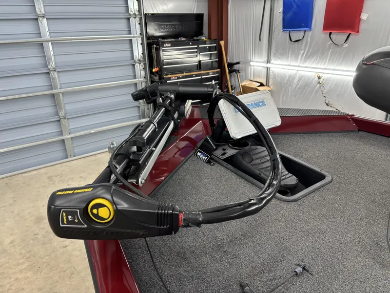 Slide: The Image of 2019 Ranger RT178 boat with trolling motor and control panel in a garage setting. - 12