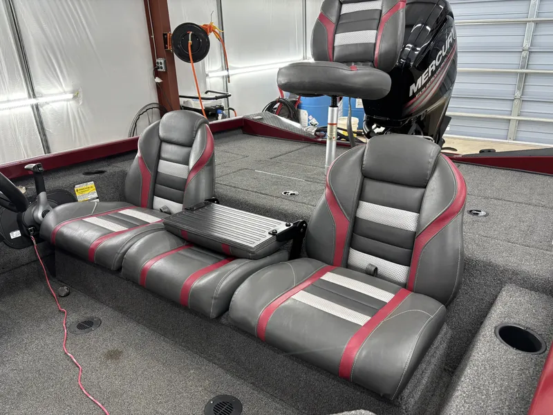 Slide: The Image of 2019 Ranger RT178 boat interior with gray and red seats, Mercury engine visible. - 13