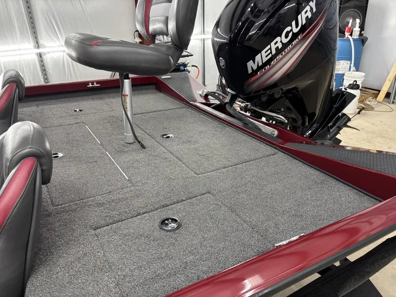 Slide: The Image of 2019 Ranger RT178 boat with Mercury FourStroke engine, featuring spacious carpeted deck and seating. - 6