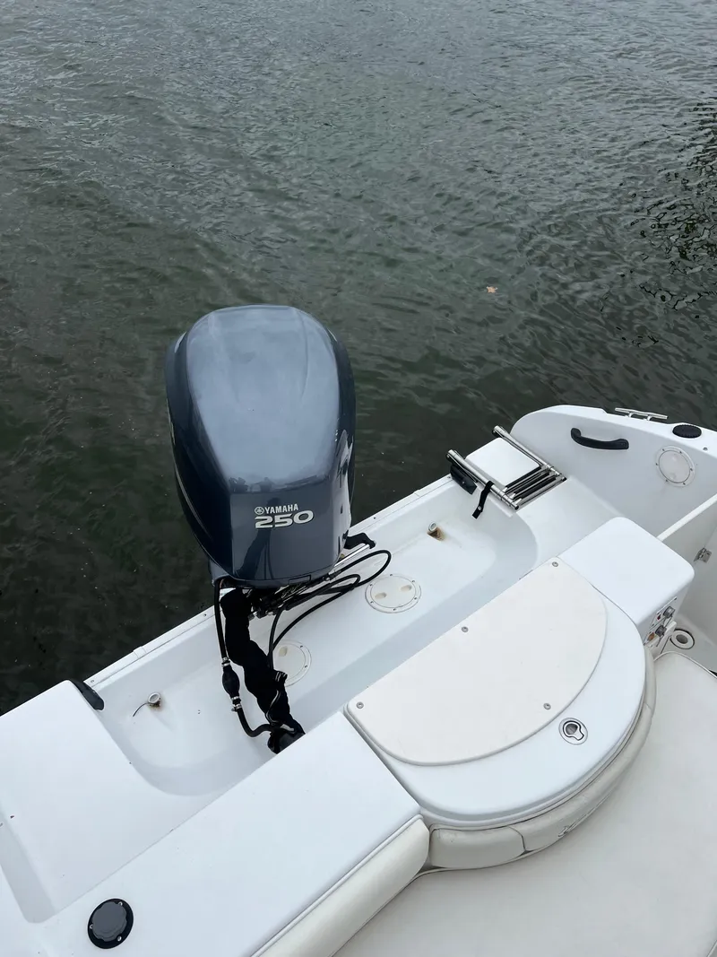 Slide: The Image of 2003 Seaswirl Striper 2301 Walkaround OB with Yamaha 250 outboard motor on water. - 16