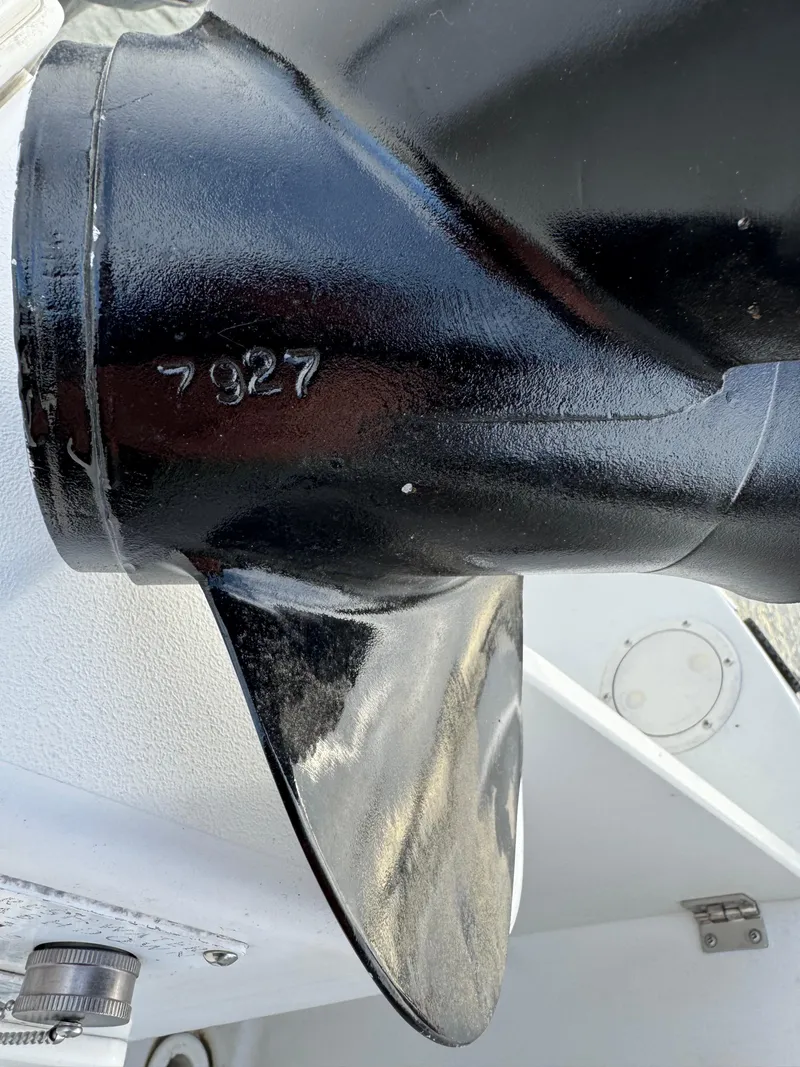 Slide: The Image of Close-up of a black propeller on a 2003 Seaswirl Striper 2301 Walkaround OB boat. - 19