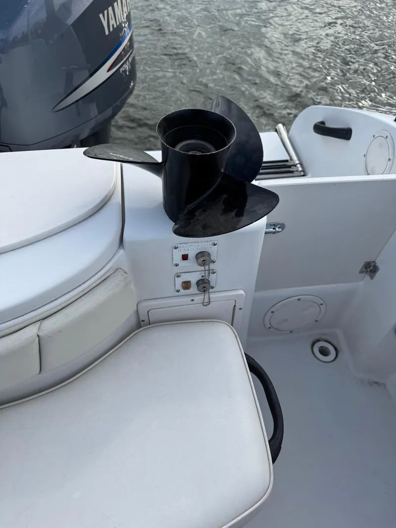 Slide: The Image of 2003 Seaswirl Striper 2301 Walkaround OB boat interior with Yamaha engine. - 3